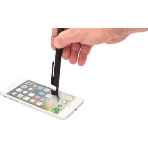 A black 6-in-1 multi pen is being used on a smartphone screen, showcasing its stylus feature.