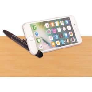 A black 6-in-1 multi pen designed with a built-in phone stand and a ruler, placed on a wooden surface.