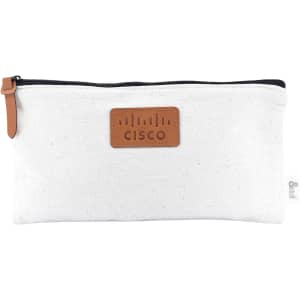 A white pencil case with a leather patch featuring a logo, closed with a black zip and a tan zipper pull.