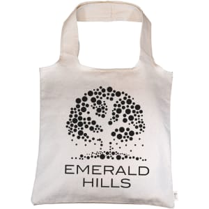 A natural-coloured tote bag with a tree design and branding, featuring shoulder straps for carrying.