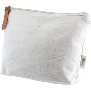 A cream-coloured toiletry or makeup bag with a leather zip pull and a logo on the side.