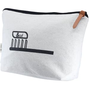 A calico toiletry/makeup bag in white with a black graphic and a brown leather zipper pull.