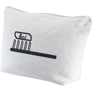 A cream toiletry/makeup bag with a simple graphic design and a zip closure. Features a logo.