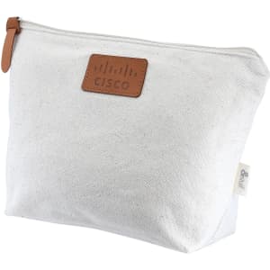 A white toiletry/makeup bag with a brown leather tag and a logo, featuring a zip closure.