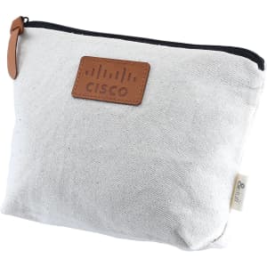 A cream toiletry pouch with a leather tag, featuring a logo, and a zip closure.