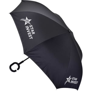 An inverted black umbrella with a C-shaped handle and a logo printed on one side.