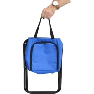 A blue cooler bag with a zippered front pocket is being held by a hand. The bag has black handles and a branding logo.