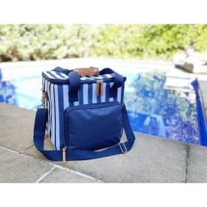 A navy cooler bag with blue and white stripes, featuring a shoulder strap and a front pocket. The bag has a logo.
