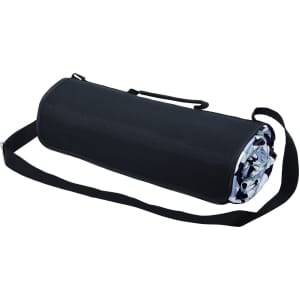 A rolled-up picnic rug in black with a patterned interior, featuring a carrying strap for easy transport.