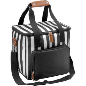 A striped black and white cooler bag with a brown handle and a black front pocket, featuring adjustable shoulder straps.