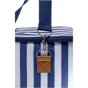 A cooler bag featuring navy and white stripes with a sturdy handle and a brown leather tag.