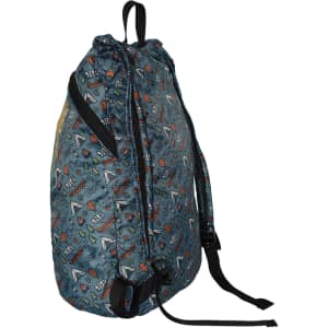 A full-colour fold-up backpack in shades of blue with a playful pattern, featuring adjustable black straps and a logo.