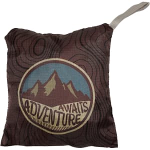 A fold-up backpack featuring a mountain design in earthy tones with a built-in carrying handle. It has a logo.
