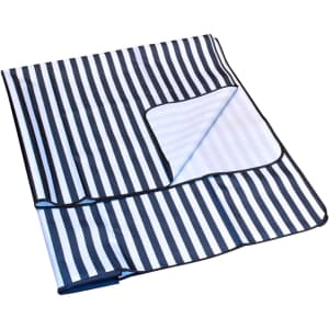 An extra-large navy and white striped picnic rug with a foldable design and black edging.