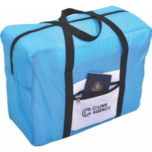A blue wheeled travel bag with black handles and a front pocket, featuring a logo. A passport is visible in the pocket.