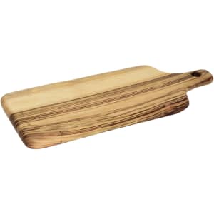 A large wooden serving board with a natural finish and unique grain patterns, featuring a handle and a hanging hole.
