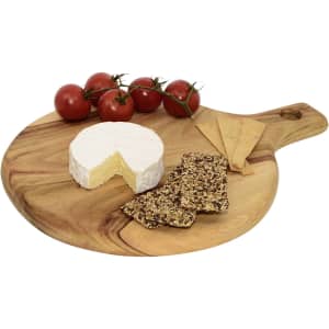 A round wooden serving board featuring cheese, crackers, and cherry tomatoes, with a handle and natural wood finish.