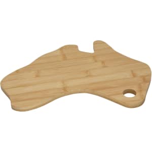 A bamboo cheese board shaped like Australia featuring a hole for hanging. It has a natural wood finish.