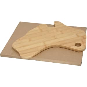 A bamboo cheese board shaped like Australia, resting on a brown cardboard base.