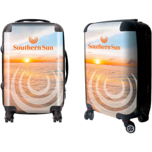 A wheeled suitcase featuring a sunset beach design with a logo. The suitcase has a glossy finish and black wheels.
