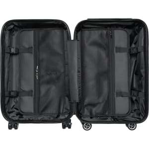A black wheeled suitcase interior featuring two compartments with mesh pockets and straps for organisation.