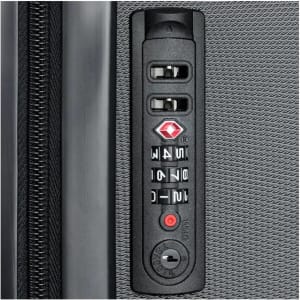 A close-up of a black carry-on suitcase's combination lock panel, featuring dials and buttons.