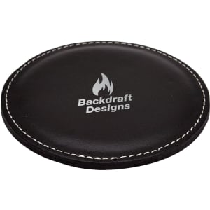 A round black coaster with a stitched edge and a logo in the centre.