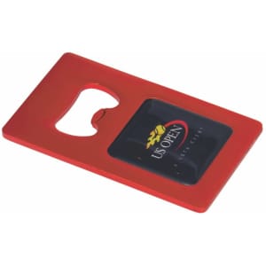 A red bottle opener keyring featuring a black panel with a logo. It has a rounded cutout for opening bottles.