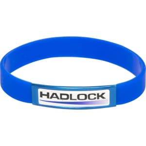 A blue silicon wristband featuring a central branding element. The wristband is flexible and smooth in texture.