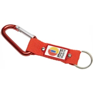 A red keyring with a carabiner clip and a fabric strap, featuring a logo on the strap.
