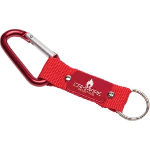 A red keyring with a metal carabiner and fabric strap, featuring a branded plate.