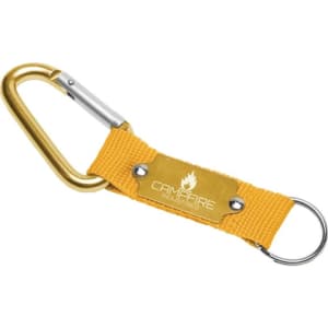 A yellow keyring with a carabiner and a fabric strap, featuring a branded metal plate.