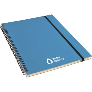 A blue A4 notebook with a spiral binding and an elastic band, featuring a logo on the cover.