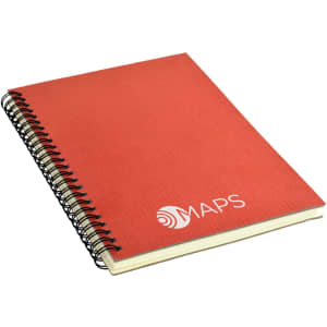 A red A5 notebook with a spiral binding and a logo on the cover.