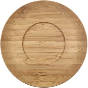 A bamboo saucer with an oval shape and textured surface, featuring a central indentation for a mug.
