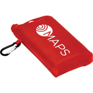 A compact red picnic mat with a carabiner clip and a logo on the surface.