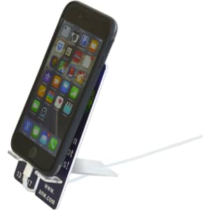 A phone stand in white, holding a black smartphone, with a display for apps visible on the screen.