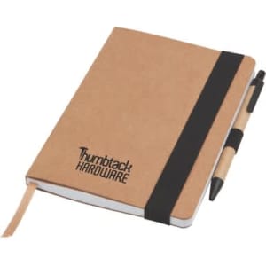 A brown notepad with a black elastic band, accompanied by a black and beige pen, featuring a logo on the cover.