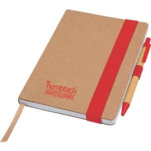 A brown notepad with a red elastic band and a matching pen resting beside it. It features a logo on the cover.