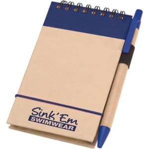 A beige notepad with a blue top section, spiral binding, and a blue pen attached. It features a logo.
