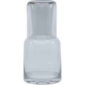 A clear glass carafe with a rounded base and a narrow neck. It has a simple, modern design.