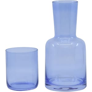 A drink bottle and tumbler set in light blue glass, featuring a sleek design and a branded logo.