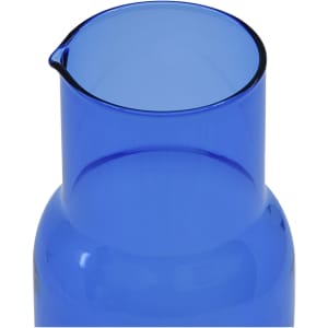 A blue glass carafe with a spout, designed for serving beverages. It has a sleek, modern shape and a shiny finish.