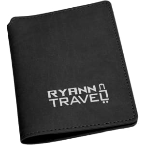 A black passport wallet with a branding logo on the front, featuring a sleek, minimalist design.