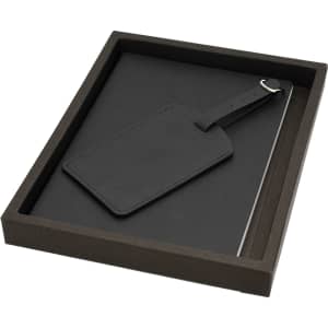 A black notebook set with a matching luggage tag, packaged in a dark box.
