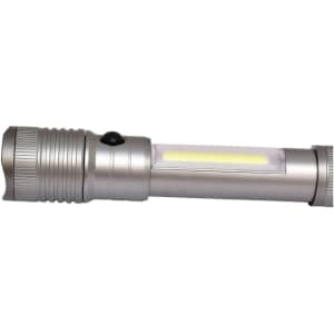 A gunmetal torch featuring a sleek design and a prominent light source in the centre. It has a logo on the body.