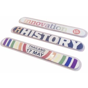 Three nail files featuring various designs, including colours of blue, red, and stripes, with a logo on each.