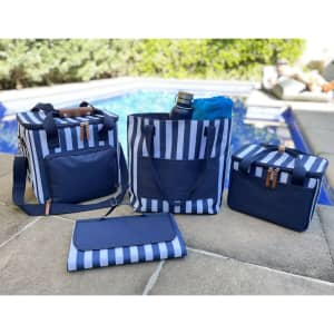 A range of navy striped cooler bags, including a large bag, a medium bag, a small bag, and a foldable item.