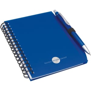 A blue notepad with a spiral binding and a matching pen, featuring a logo on the cover.