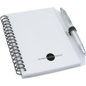 A white notepad with a spiral binding and a silver pen, featuring a logo on the front.